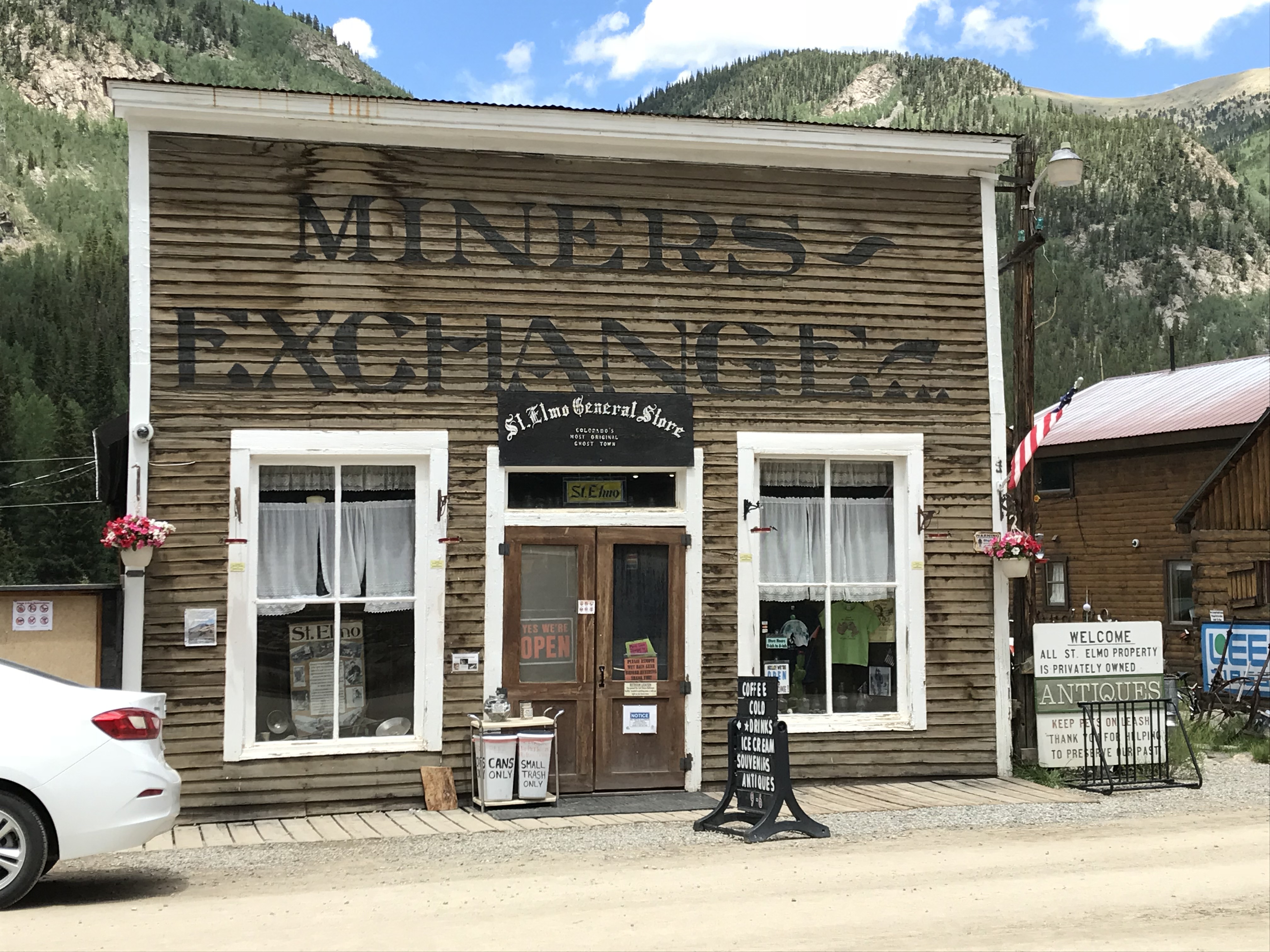 An old, one-story shop that reads, "Miners Exchange, St. Elmo General Store"